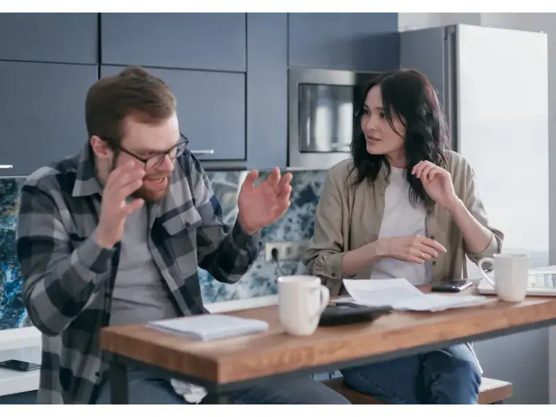 a man having a discussion with a woman