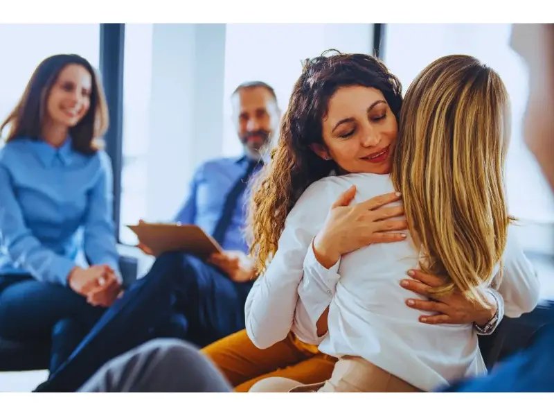 Woman hugging on therapy